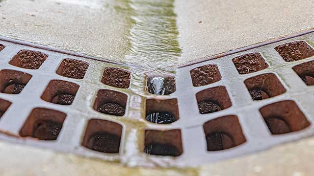 water running down storm basin