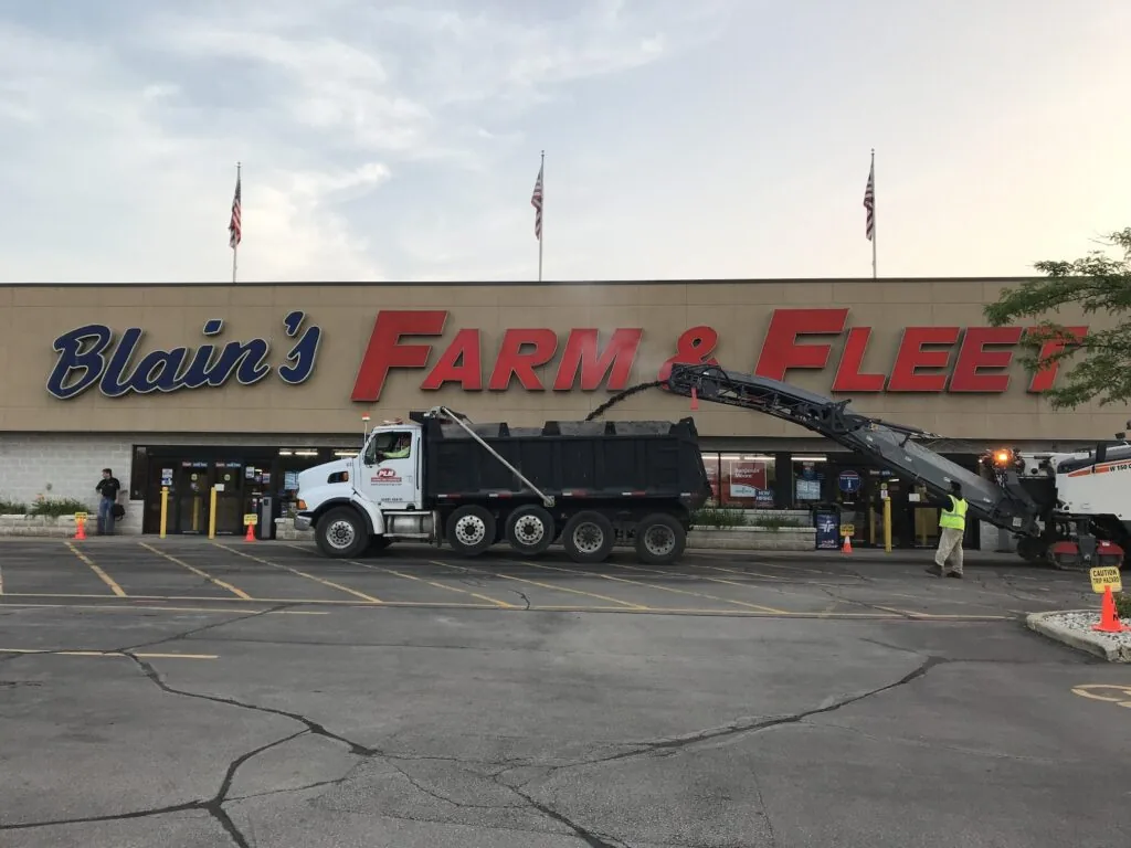 PLM Paving & Concrete truck outside of a Blain's Farm & Fleet store