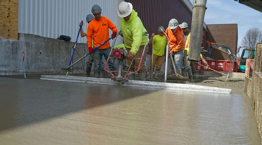 PLM employees installing concrete