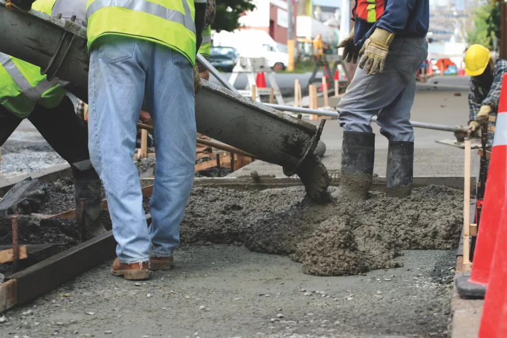 plm paving employees pouring concrete
