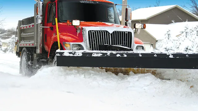snow plow truck plowing snow