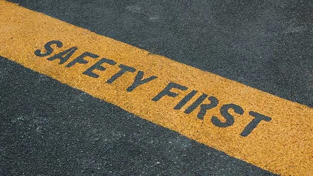 "safety first" letters painted into pavement