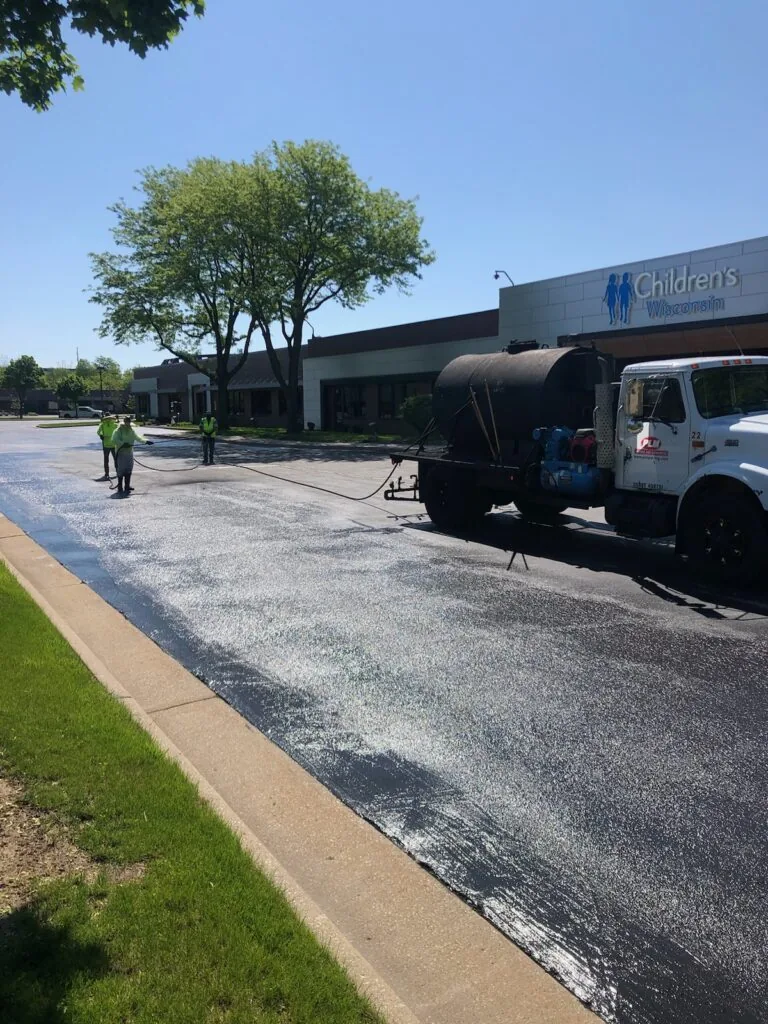 sealcoating the parking lot for children's wisconsin