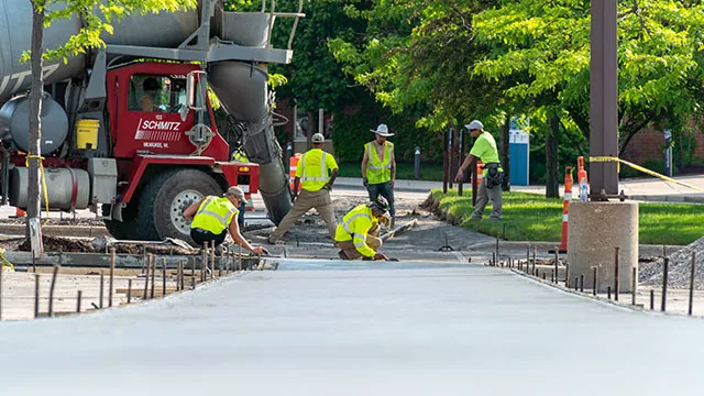 plm paving employees and a concrete driveway