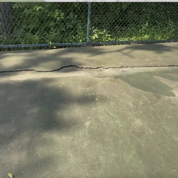 Damaged Old Tennis Court