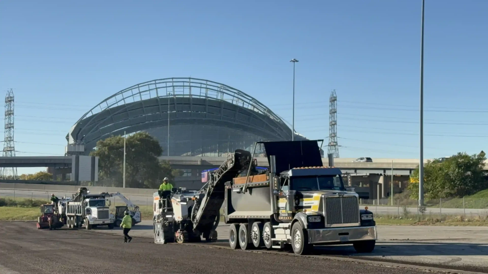 2 Milling trucks performing asphalt milling at the Milwaukee Brewers Stadium