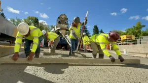 PLM crew laying out a concrete surface