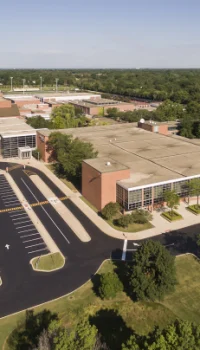 aerial view of a school and parking lot