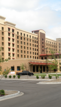 Hotels.png front of a beige hotel