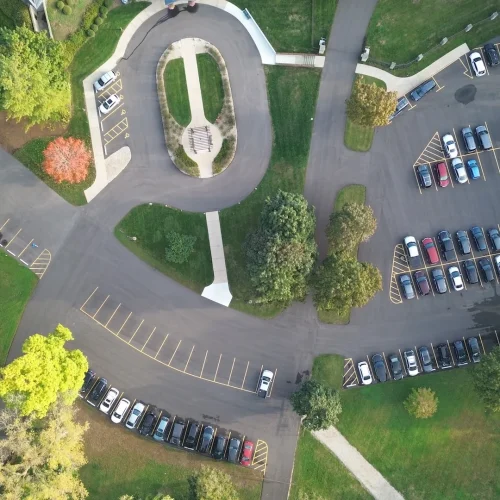 Aerial after shot of asphalt, line striping and concrete sidewalks done at St. Benedicts Abbey.