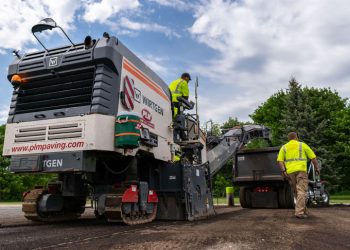 plm paving employees operating a cold planer
