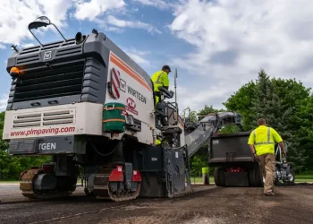 plm paving employees operating a cold planer
