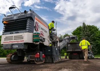 plm paving employees operating a cold planer