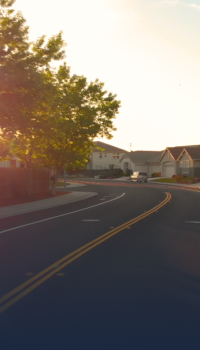 municipalities.png windy road with row of houses in the background
