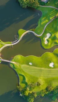 aerial view of a golf course with two lakes
