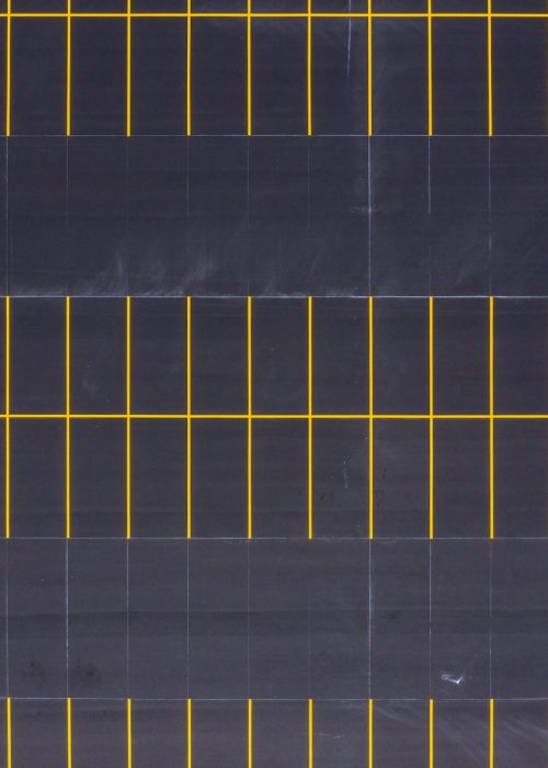 aerial view of freshly painted yellow parking spots